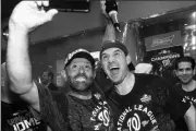  ?? ASSOCIATED PRESS ?? WASHINGTON NATIONALS’ RYAN ZIMMERMAN and Dr. Hirad Bagy celebrate after Game 4 of the National League Championsh­ip Series against the St. Louis Cardinals Wednesday in Washington. The Nationals won 7-4 to win the series 4-0.