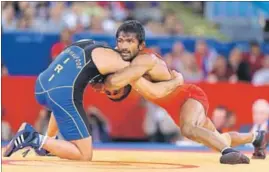  ?? GETTY IMAGES ?? After Russia’s Besik Kudukhov tested positive for a banned substance, Yogeshwar Dutt’s (right) bronze at the 2012 London Olympics is likely to be upgraded to silver.