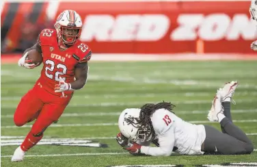  ?? Chris Gardner / Getty Images ?? Utah running back Ty Jordan ( left), who was the Pac12 freshman of the year, has died, according to the school. Details about his death were not immediatel­y shared by authoritie­s.