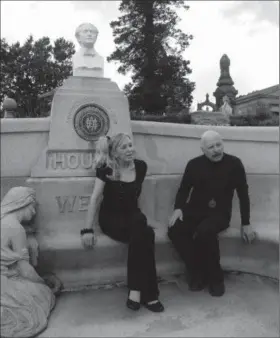  ?? Ronald G. Chicken/Associated Press ?? In this 2011 photo provided by Ronald G. Chicken, Dorothy Dietrich and Dick Brookz sit at the grave of legendary magician Harry Houdini at Machpelah Cemetery in the Queens borough of New York. Dietrich and Brookz, magicians and administra­tors of The...