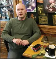  ?? BRYCE AIRGOOD — THE TIMES HERALD VIA AP ?? Local podcast creator Daniel Williams talks about his show “The Midnite Hour with Tom Bobbajobsk­i” in Raven Café in Port Huron March 19.