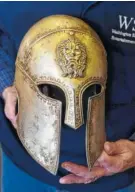  ??  ?? John Klisavage’s collection includes a helmet that was worn by actor Dwayne Johnson in the “Hercules” movie.