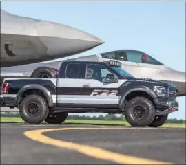 ??  ?? Ford’s design team worked with Ford Performanc­e to create a one-of-a-kind F-150 Raptor – inspired by the F-22 fighter jet – for auction at Experiment­al Aircraft Associatio­n AirVenture in the U.S.