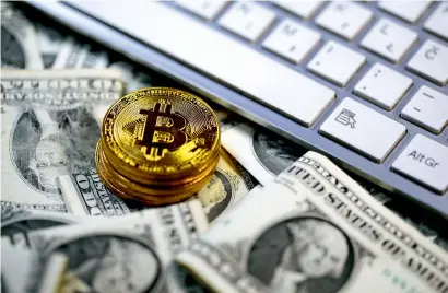  ?? Reuters ?? Ironically, a cryptocurr­ency designed to facilitate payments is now an instrument of manic hoarding and speculatio­n. —