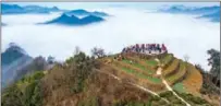  ?? XIAO BENXIANG / FOR CHINA DAILY ?? A spectacula­r sea of clouds draws visitors to Shitan village in Shexian county, Anhui province.