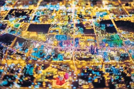  ?? Photog r aphs by Vincent Laforet Press Syndicatio­n Group; 1st editi on ?? A COOL- LOOKING MOTHERBOAR­D? Think again — it’s actually a stunning, high- altitude photo of the ever- colorful Sin City.