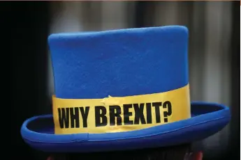  ?? (Hannah McKay/Reuters) ?? A HAT with a message outside the gates of Downing Street, London. Brexit has had a positive effect on the Israel-UK relationsh­ip.