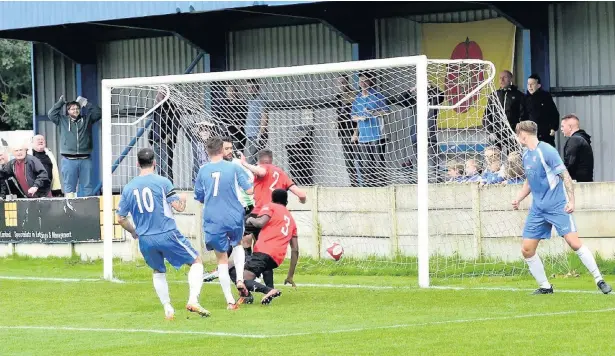  ?? Frank Crook ?? Olly Crankshaw nets the third goal in Ramsbottom United’s 3-1 FA Trophy win against Sheffield. See page 62.