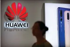  ?? MARK SCHIEFELBE­IN/AP FILES ?? Some experts say it’s unlikely that Huawei might install software “backdoors” that Beijing could use for spying.