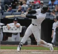  ?? JULIE JACOBSON — ASSOCIATED PRESS ?? Didi Gregorius connects for a two-run home run during Yankees' victory over Reds.