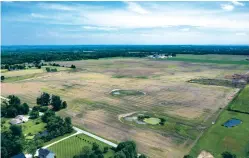  ?? GENE J. PUSKAR/ASSOCIATED PRESS FILE PHOTO ?? An aerial image taken in June shows a portion of land in Johnstown, Ohio, where Intel plans to build two new processor factories. Though Intel’s announceme­nt has been greeted as an economic boon, the project has also raised concerns about its impact on a region suffering a housing shortage.