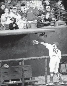  ?? MARK WEBER / THE COMMERCIAL APPEAL ?? Redbirds third baseman Jacob Wilson can’t handle a catch near the dugout during the fifth inning against St. Louis Cardinals on Friday at AutoZone Park.