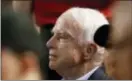  ??  ?? Sen. John McCain, R-Ariz., watches a baseball game between the Arizona Diamondbac­ks and the Los Angeles Dodgers Thursday in Phoenix.