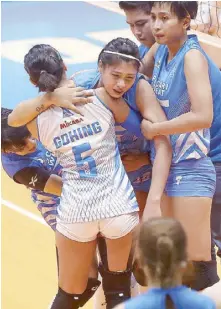  ?? MIGUEL DE GUZMAN ?? Pocari’s Myla Pablo is carried by teammates after sustaining a back injury during their game against BaliPure at the Filoil Flying V Center in San Juan City yesterday.