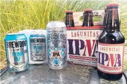  ?? PATRICK HOLBROOK/THE COLUMBUS DISPATCH ?? Nonalcohol­ic beers, from left, BrewDog’s Punk AF IPA; WellBeing’s Intentiona­l IPA; and Lagunitas’ IPNA.