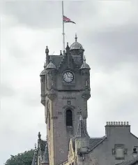  ??  ?? Tribute The town hall flag at half mast following the bomb attack in Manchester
