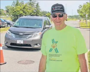  ?? COREY LEBLANC/THE CASKET ?? Chuck Gardiner of Antigonish is one of hundreds of volunteers for the Special Olympics Canada 2018 Summer Games already hard at work early Monday afternoon on the St. Francis Xavier University campus in Antigonish.