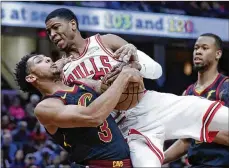  ?? TONY DEJAK / ASSOCIATED PRESS ?? Cleveland Cavaliers’ Cameron Payne (left) and Chicago Bulls’ Shaquille Harrison battle for the ball in the first half of an NBA basketball game, Monday in Cleveland.