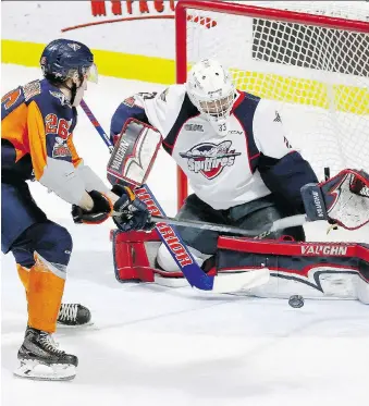  ?? NICK BRANCACCIO ?? Spitfires goalie Brock Baier makes a stop on the Flint Firebirds’ Ryan Littlejohn after a Windsor giveaway in the first period at the WFCU Centre Sunday.