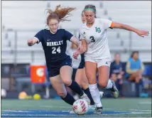  ?? TIMOTHY ARRICK — FOR MEDIANEWS GROUP ?? Lake Orion’s Anna Wandrie and Berkley’s Alana Blatt battle for possession as the two teams played to a 1-1draw Thursday, May 4, 2023 in Berkley.