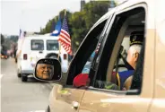  ??  ?? John McCaffrey of the American Legion’s Alexander Hamilton Post 448 drives down Jefferson Street during the Veterans Day Parade.