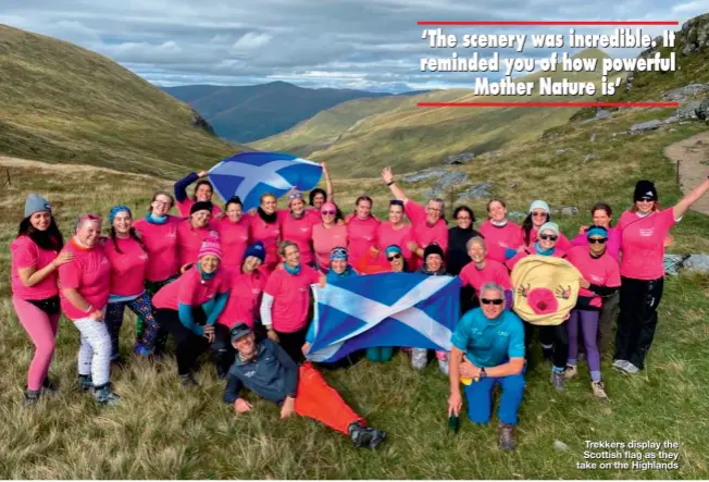  ?? ?? Trekkers display the Scottish flag as they take on the Highlands