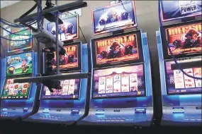  ?? Wayne Parry / Associated Press ?? Slot machines at the Hard Rock casino in Atlantic City, N.J., that are controlled by gamblers over the internet on Feb. 10