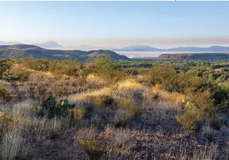  ??  ?? HOLY GROUND
A view from the San Carlos Apache
Reservatio­n, one of the areas where Edwards’ religious movement took
hold. In recent years, the tribe’s sacred lands have been at the center of a land swap con
troversy between the U.S. government and a copper mine.