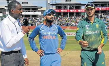 ?? /Lee Warren/Gallo Images ?? Debut toss: Michael Holding, left, and Virat Kohli look on as Aiden Markram tosses up before Sunday’s one-day internatio­nal at Centurion. It was Markram’s first match as SA captain and he was given a taste of reality by Kohli’s side.