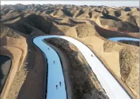  ?? ?? Members of China’s Paralympic cross-country skiing and biathlon teams conduct their final preparatio­ns for Beijing 2022 at Baiyin national training base, a state-of-the-art facility situated in the stunning landscape of Northwest China’s Gansu province.