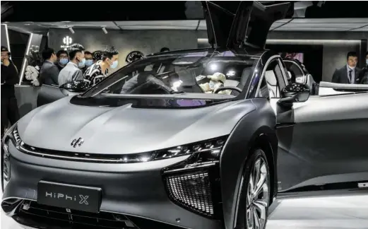  ?? BILD: SN/XINHUA/PICTUREDES­K ?? E-Start-up in China: Der HiPhi von Human Horizons soll dem Tesla X Konkurrenz machen.