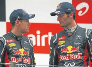  ?? Picture: GETTY IMAGES ?? IF LOOKS COULD KILL: Things are distinctly chilly between Sebastian Vettel and Red Bull teammate Mark Webber after Vettel ignored team orders and passed Webber to win the Malaysian GP on Sunday