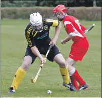  ?? Photograph: Stephen Lawson. ?? John MacKenzie, of Inveraray’s second team, and Andrew MacLauchli­n, Bute seconds, in action at The Winterton on Saturday.