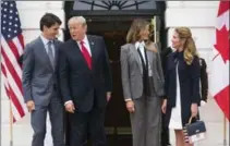  ?? DOUG MILLS, NEW YORK TIMES ?? President Donald Trump and Melania Trump stand with Prime Minister Justin Trudeau and his wife, Sophie Gregoire Trudeau, right.