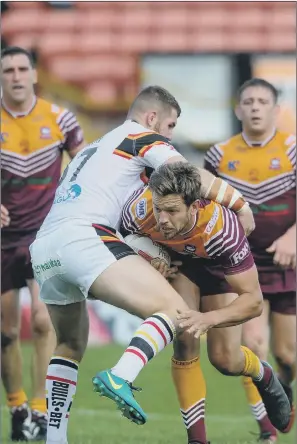  ?? PICTURE: JAMES HARDISTY ?? STOP RIGHT THERE: Bradford Bulls’ Cameron Smith tackles Batley Bulldogs’ Patrick Walker during yesterday’s Kingstone Press Championsh­ip Shield at the Provident Stadium, Odsal.