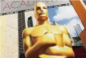  ?? Matt Sayles/Associated Press ?? An Oscar statue appears outside the Dolby Theatre for the 87th Academy Awards in Los Angeles.