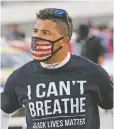  ?? STEVE HELBER/ASSOCIATED PRESS FILE PHOTO ?? Driver Bubba Wallace wears a Black Lives Matter shirt on June 10 in Martinsvil­le, Va.