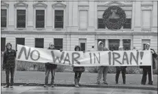  ?? KATIE FYFE/THE JOURNAL-GAZETTE VIA AP ?? An anti-war rally is hosted Saturday at the Allen County Courthouse in Fort Wayne, Ind., by United Activists of Fort Wayne Indiana and Fort Wayne for Peace to urge peace and diplomacy in response to the U.S. airstrike that killed an Iranian general.