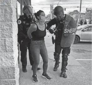  ?? PROVIDED PHOTO/SPECIAL TO THE REGISTER ?? Des Moines Register reporter Andrea Sahouri is arrested by Des Moines police May 31 while covering a protest.