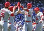  ?? KAMIL KRZACZYNSK­I — THE ASSOCIATED PRESS ?? The Cardinals' Paul Goldschmid­t, second from right, is greeted at home plate after hitting a three-run homer in the third inning Friday.