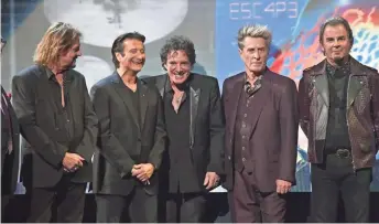  ?? MIKE COPPOLA/GETTY IMAGES ?? Gregg Rolie (from left), Steve Perry, Neal Schon, Ross Valory and Jonathan Cain of Journey speak at the Rock and Roll Hall of Fame induction ceremony on April 7, 2017.