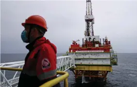  ?? REUTERS ?? Representa­tional photo: An employee is seen at an oil platform operated by Lukoil company at the Kravtsovsk­oye oilfield in the Baltic Sea, Russia on 16 September 2021.