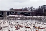  ?? CP PHOTO AARON VINCENT ELKAIM ?? Ice is seen Wednesday in the high waters of the Grand River in Brantford where residents were being evacuated due to flooding after an ice jam upstream of Parkhill Dam sent a surge of water downstream.