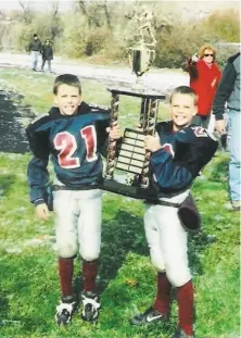  ?? Rogers family ?? Tyler (left) and Taylor Rogers celebrate a football title. Tyler is a reliever with the Giants. Taylor pitches for Minnesota.