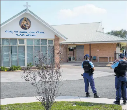  ?? PHOTO / AP ?? Police patrol outside the Christ the Good Shepherd church in western Sydney after a knife attack that wounded a bishop and a priest during a church service.