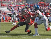  ?? MARK LOMOGLIO - THE ASSOCIATED PRESS ?? Tampa Bay Buccaneers wide receiver Mike Evans (13) beats New York Giants cornerback Janoris Jenkins (20) to the endzone to score his third touchdown during the first half of an NFL football game Sunday, Sept. 22, 2019, in Tampa, Fla.