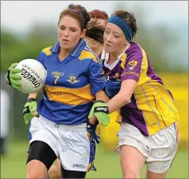  ??  ?? Kellie Kearney in action on one of her first really big days in a Wexford jersey, tackling Tipperary’s Shauna Ryan in the 2010 All-Ireland Minor ‘B’ final in Freshford.