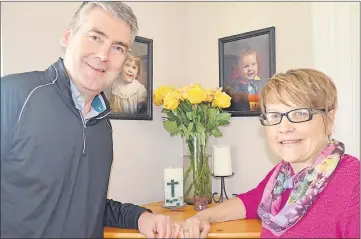  ?? LAWRENCE POWELL ?? Nova Scotia Premier Stephen Mcneil with his wife, Andrea, in front of family photos and a vase of 10 yellow roses. Andrea Mcneil presented him with the flowers when he arrived home from work on April 28 – exactly 10 years to the day he was elected...