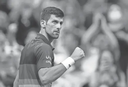  ?? DANIELLE PARHIZKARA­N/USA TODAY SPORTS ?? Novak Djokovic of Serbia reacts after winning a quarterfinal match against Matteo Berrettini during the U.S. Open at USTA Billie Jean King National Tennis Center on Wednesday.