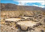  ?? ERNIE COWAN ?? Some researcher­s have speculated that the rock rings were sleeping circles.